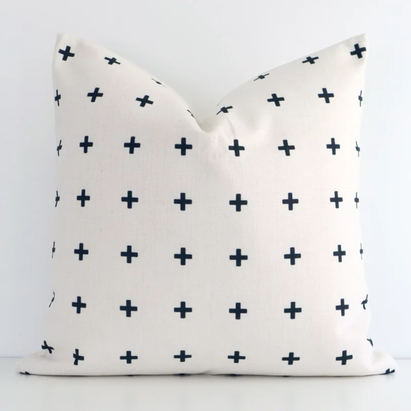cora-illusions-cushion-cover---sc249-45 A white wall that has a black patterned cushion cover positioned in front of it. It has an exquisite linen material and a lovely square shape.