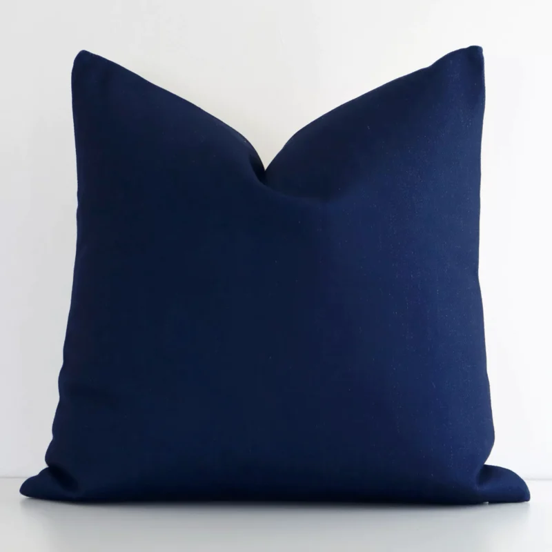 dark-blue-aztec-cushion-cover---45cm-x-45cm---sc613-45 Dark blue linen cushion cover features prominently against a white wall. It is a square design and has a solid-coloured finish.