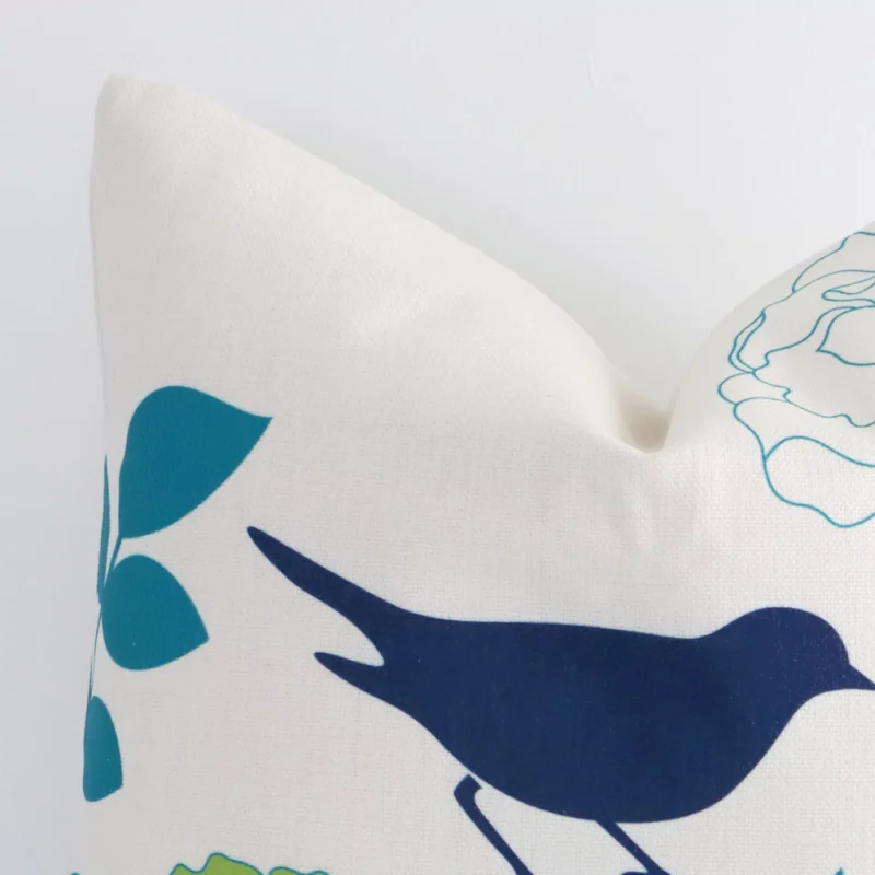 A magnified shot of a floral linen cushion cover in a square size and a colourful print.