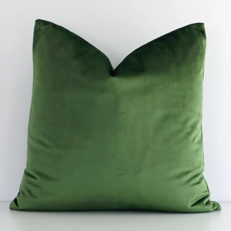 forest-green-velvet-linen-cushion-cover---sc514-45 A pretty solid-coloured velvet cushion cover is shown against a white wall. It features a square shape and a forest green colour finish.