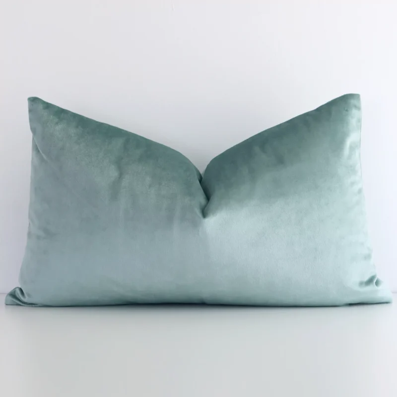 Lovely mint green solid-coloured cushion made from velvet fabric and in an elegant rectangle shape.