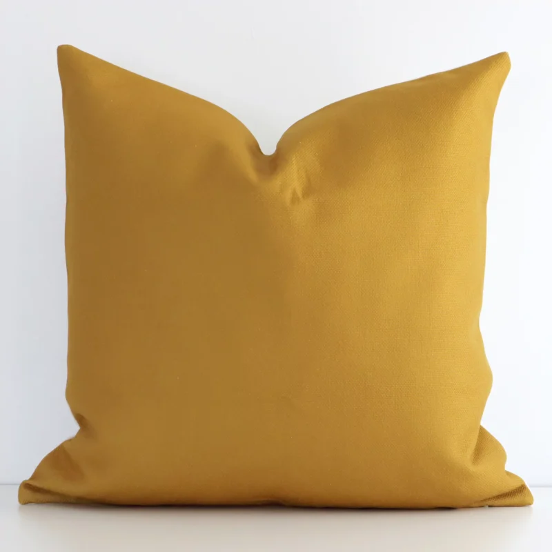 mustard-aztec-cushion-cover---sc612-45 An eye-catching linen square cushion cover featuring a hue that is mustard. It has a solid-coloured style.