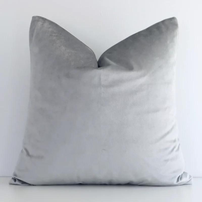 silver-velvet-linen-cushion-cover---sc502-45 Square solid-coloured cushion cover in silver colour sitting upright in front of a brick wall. It has been made from a quality velvet material.