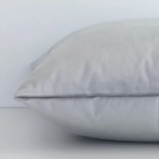 Square velvet cushion cover positioned flat to show seams. The silver hue and solid-coloured design are shown between front and rear fabric panels.