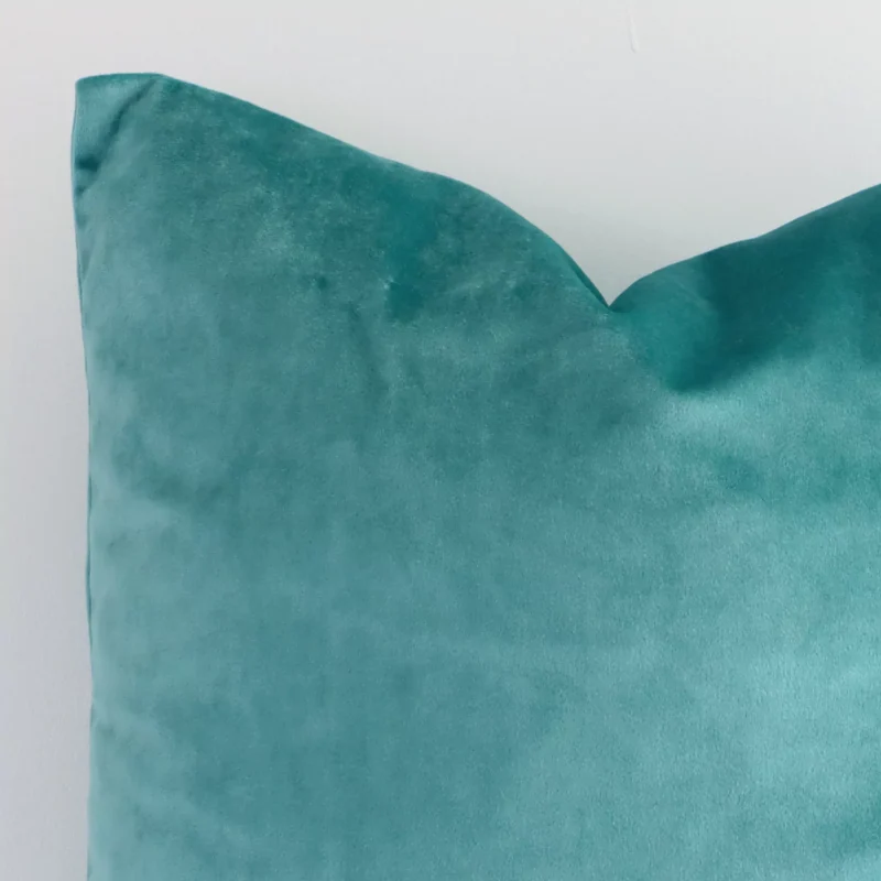 A detailed shot of this spearmint solid-coloured cushion cover that has velvet fabric and a square size.