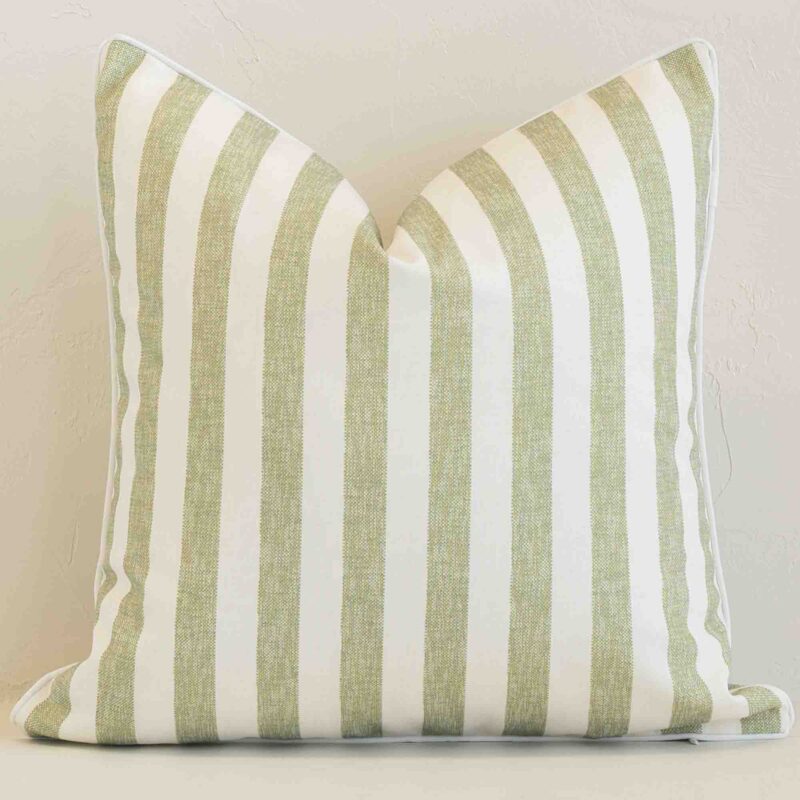Sage stripe cushion cover sits against a white wall. It is constructed from a superior looking outdoor material and has square dimensions.