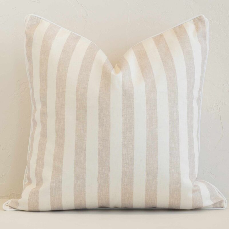 Pacific Sand Waterproof Striped Outdoor Cushion Cover - SC1065-45 Square stripe cushion cover in sand colour sitting upright in front of a brick wall. It has been made from a quality outdoor material.
