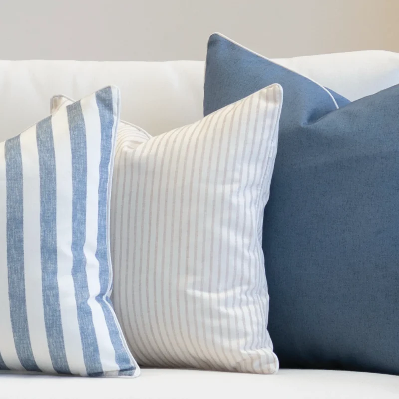 3 outdoor couch cushions in a pacific cove colour displayed on a seat.