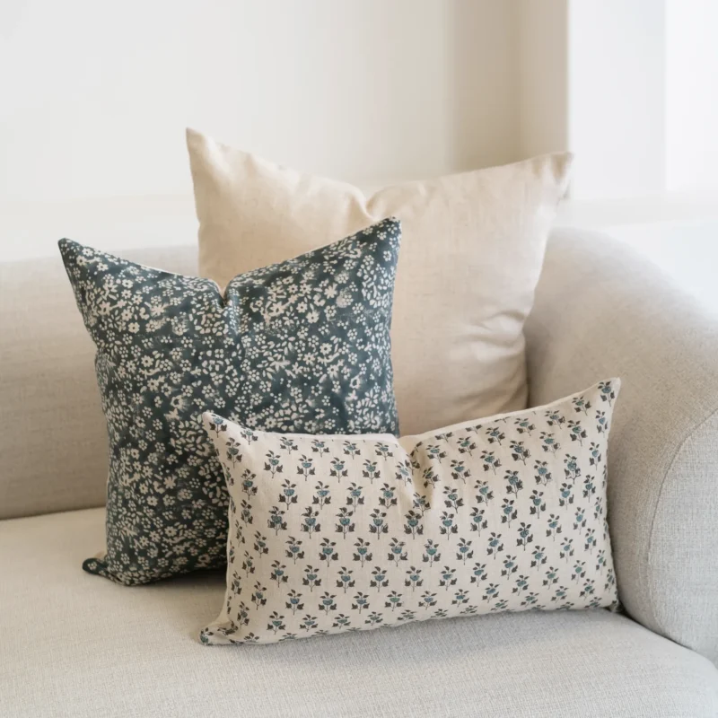 A natural-coloured sofa is styled with the set of 3 designer covers.