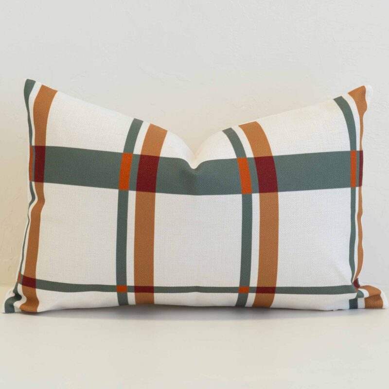 Plaid rectangular cushion cover in soft ivory with muted green, rust and ochre lines for a warm, tailored look.