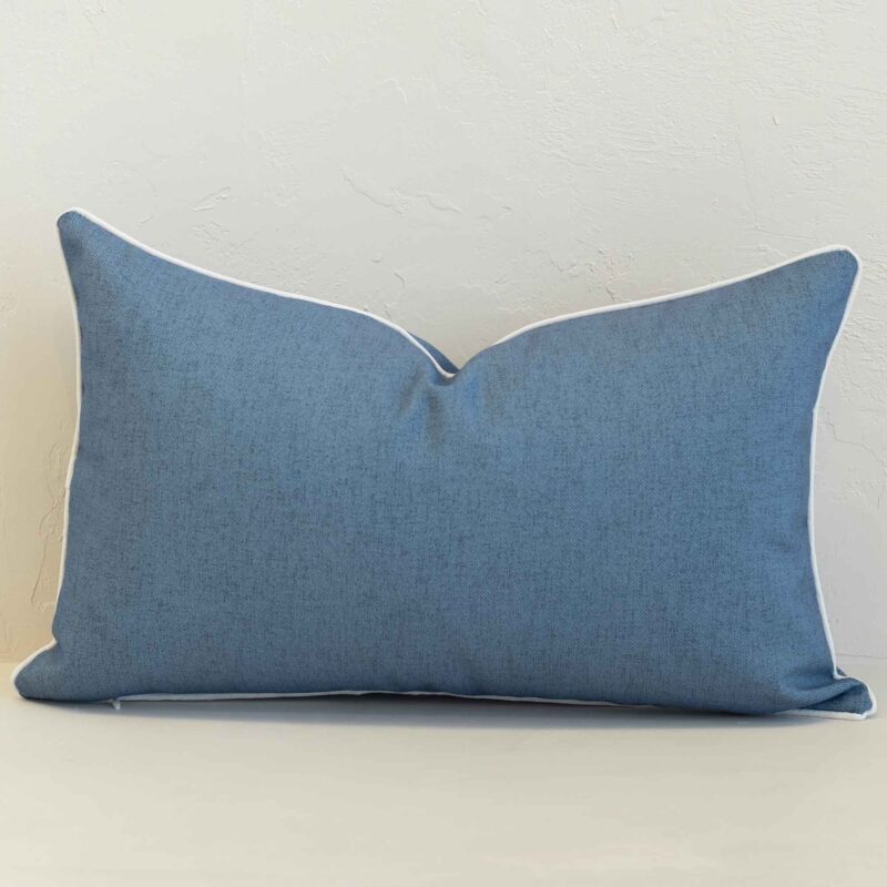 pacific-waterproof-blue-outdoor-cushion-cover-–-rectangle-sc1070-30 Pacific blue rectangular cushion with white piping on plain background.