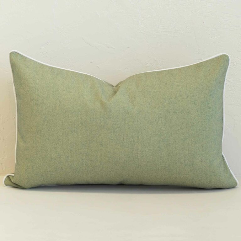 Pacific sage rectangular cushion with subtle textured fabric and white piping.