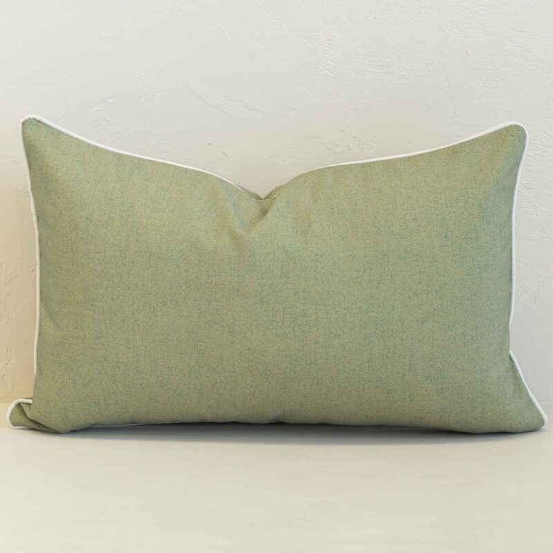 Pacific sage rectangular cushion with subtle textured fabric and white piping.