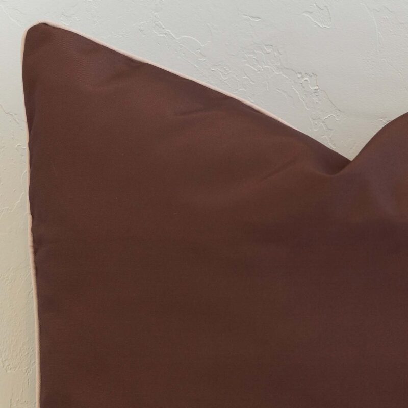 Rich chocolate brown outdoor cushion cover with a smooth, understated finish, offering depth and grounding to any outdoor setting.
