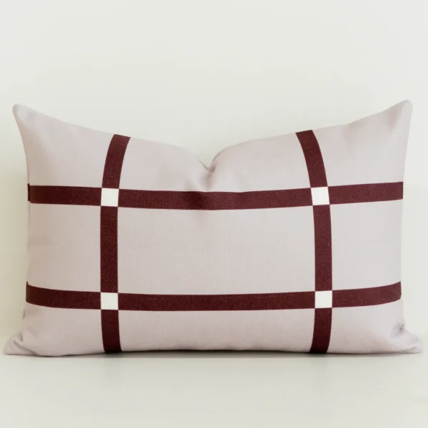 Blush pink rectangle cushion cover with burgundy check pattern.
