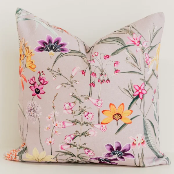 Mauve cushion cover with colourful pink, orange and purple florals.