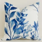 Blue watercolour leaf print cushion cover on white cotton-linen.