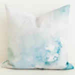 Cushion cover with aqua watercolour floral print.