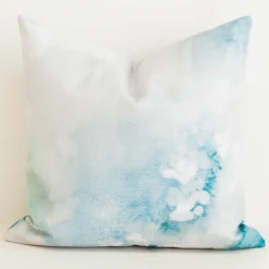Cushion cover with aqua watercolour floral print.