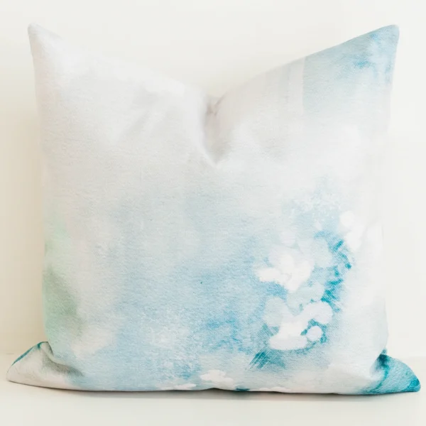 Cushion cover with aqua watercolour floral print.