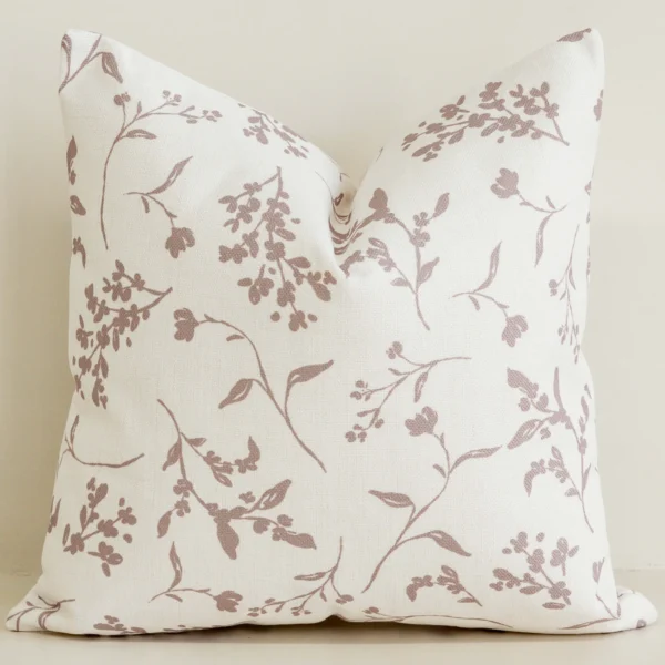Dusty pink floral sprig cushion cover on cream cotton-linen.